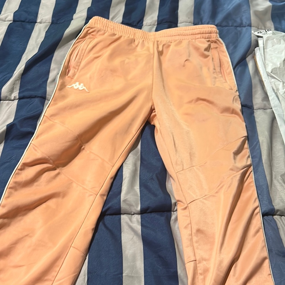 Men’s size small, kappa, pink track pants. Never worn.